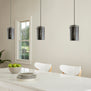 Large black pendant light in the dining room