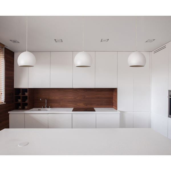 Beautiful white pendant light with globe shade in a kitchen